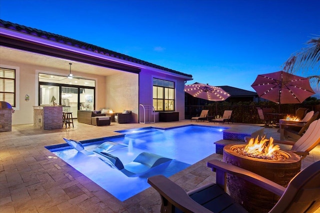 view of pool with a patio area, an outdoor living space with a fire pit, a ceiling fan, and fence