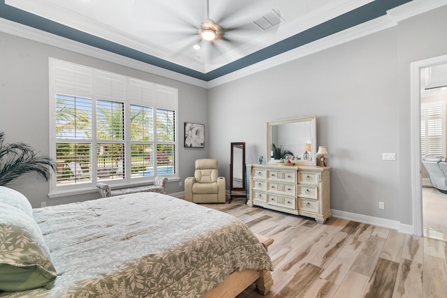 bedroom with multiple windows, ornamental molding, and wood finished floors