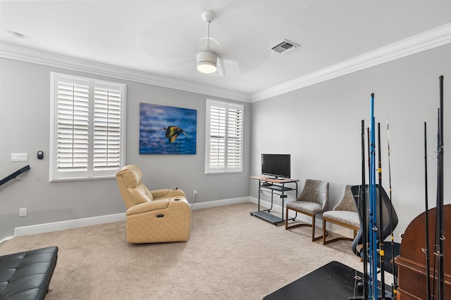 sitting room featuring ceiling fan, ornamental molding, carpet, and baseboards