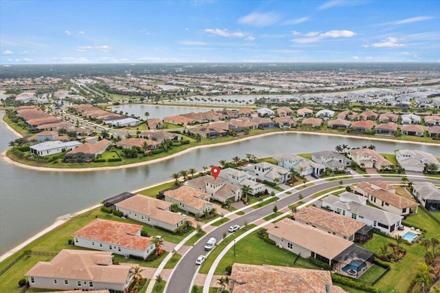 aerial view featuring a water view and a residential view