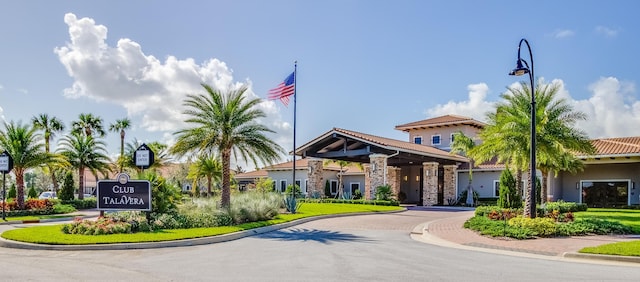 view of building exterior featuring decorative driveway