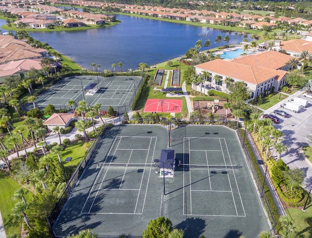 birds eye view of property with a water view and a residential view