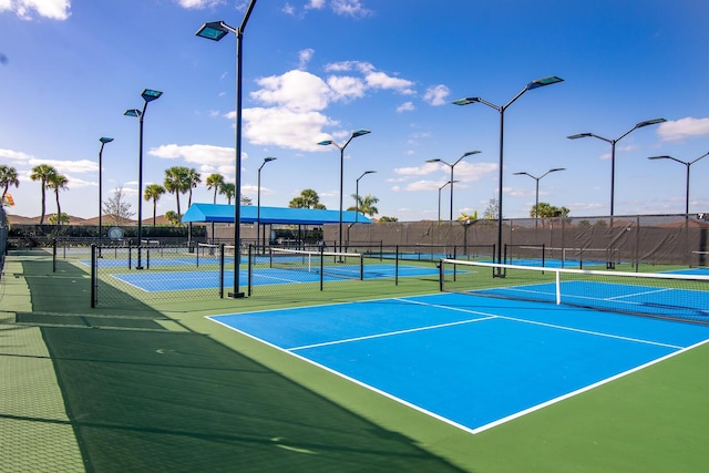 view of sport court featuring fence