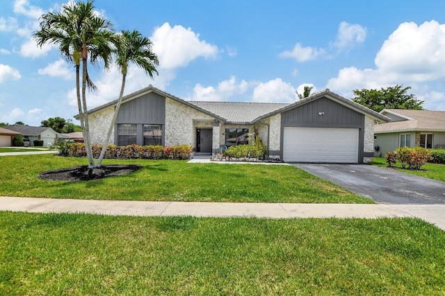 ranch-style house with a front yard and a garage