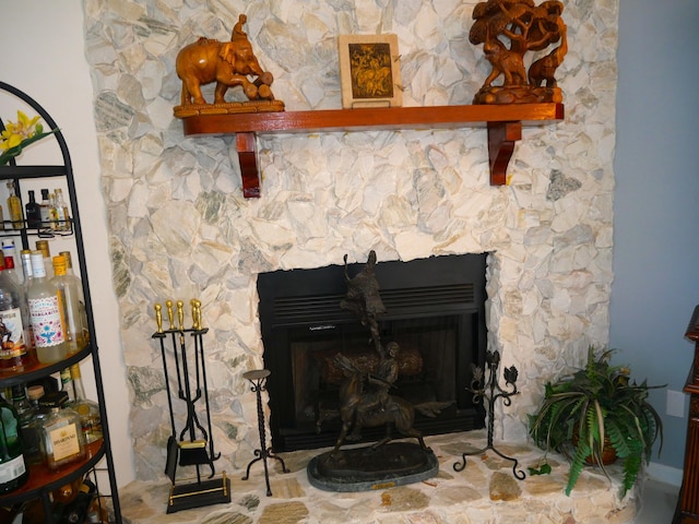 interior details with a stone fireplace