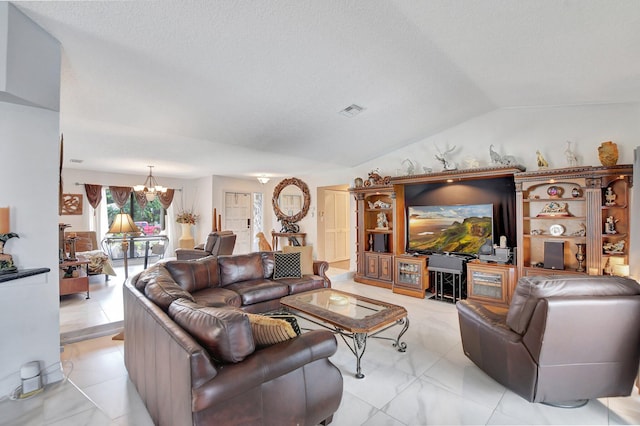 living room with a textured ceiling, vaulted ceiling, and a notable chandelier