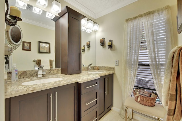 bathroom featuring tile patterned flooring, a textured ceiling, vanity, and crown molding