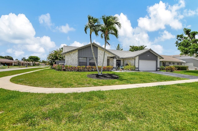 view of front facade with a front lawn and a garage