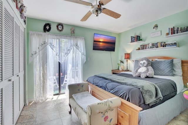 bedroom with a closet, ceiling fan, and light tile patterned flooring