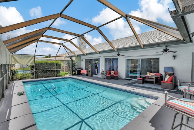 view of swimming pool featuring an outdoor hangout area, a patio, ceiling fan, and a lanai