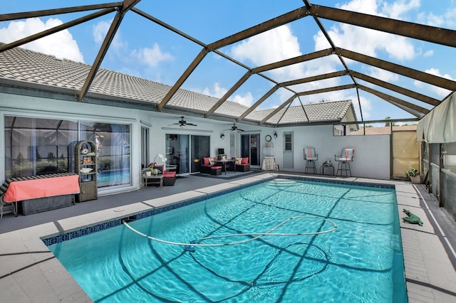 view of swimming pool with a lanai, ceiling fan, a patio, and an outdoor hangout area