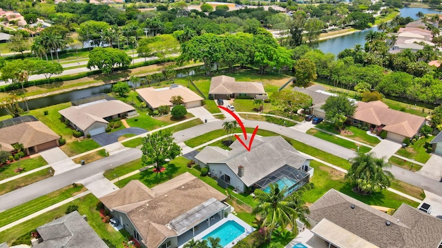 birds eye view of property featuring a water view