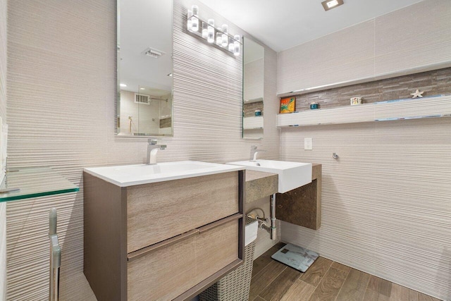 bathroom featuring tile walls and vanity