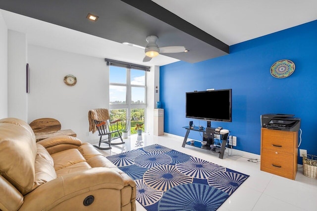 living room featuring ceiling fan, light tile patterned floors, and beamed ceiling