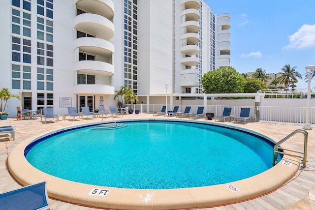 view of swimming pool featuring a patio