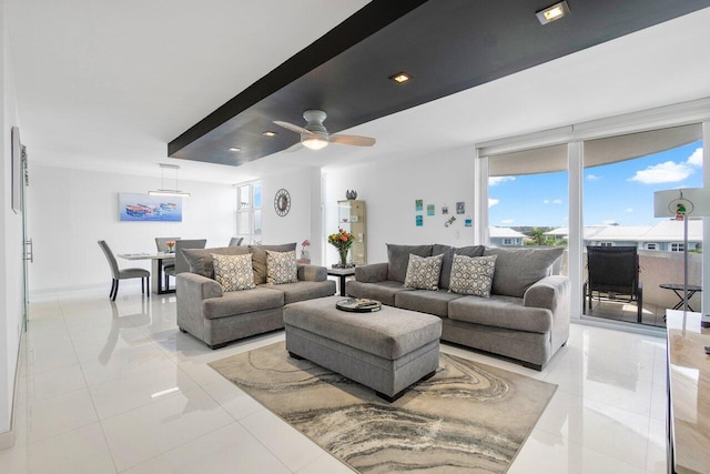 tiled living room featuring ceiling fan