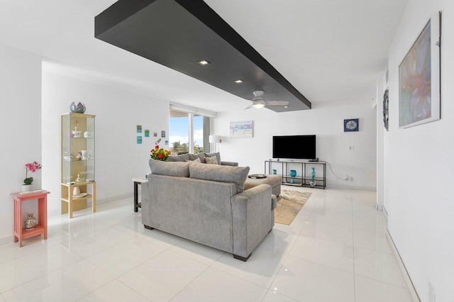 tiled living room with ceiling fan