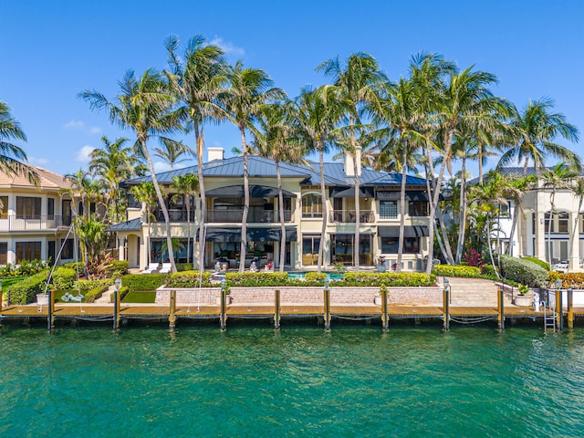 back of house featuring a water view