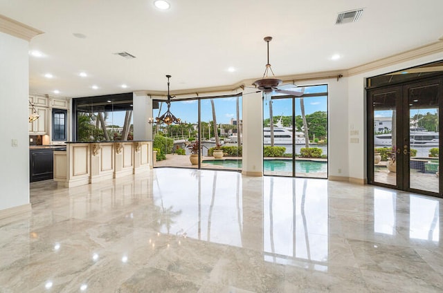 interior space with french doors and ornamental molding