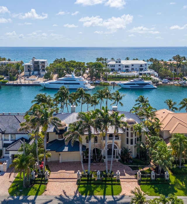 birds eye view of property with a water view