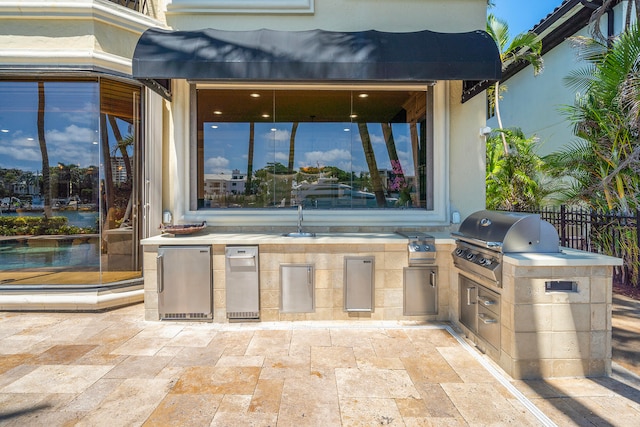 view of patio featuring a grill and exterior kitchen