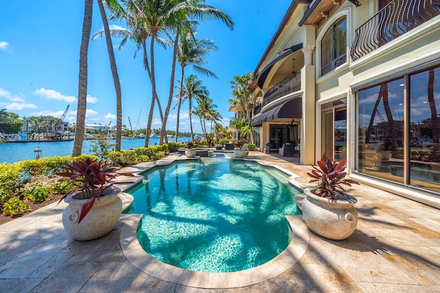 view of pool featuring a water view