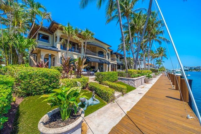 surrounding community featuring a water view