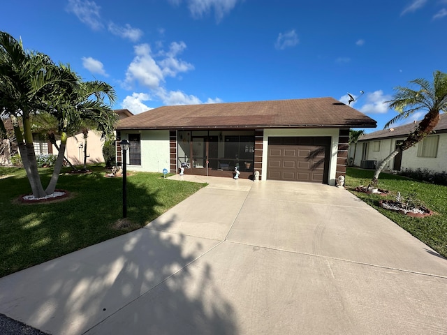 ranch-style house with a front lawn and a garage