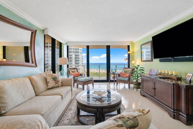 tiled living room featuring floor to ceiling windows, a water view, ornamental molding, and a textured ceiling