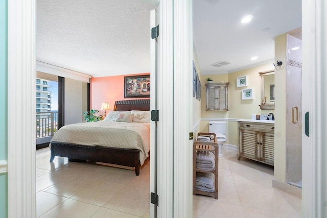 bedroom with crown molding, a textured ceiling, access to exterior, sink, and light tile floors