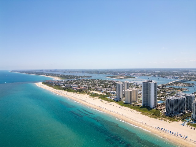 birds eye view of property featuring a view of the beach and a water view