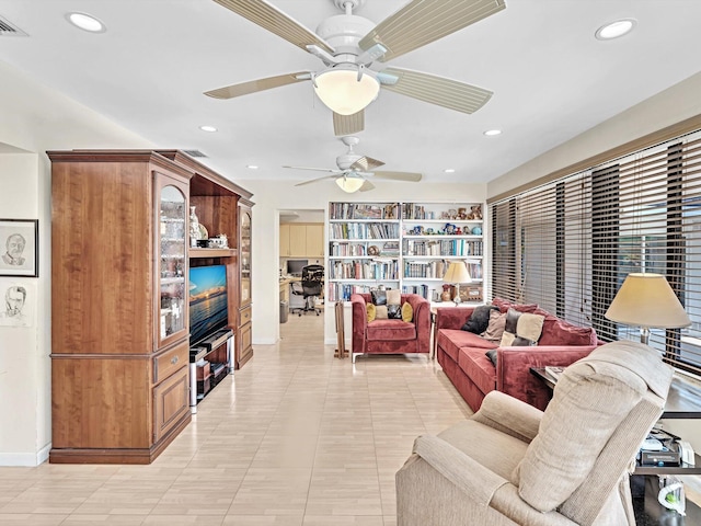 tiled living room featuring ceiling fan