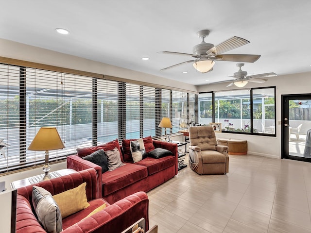 tiled living room with ceiling fan