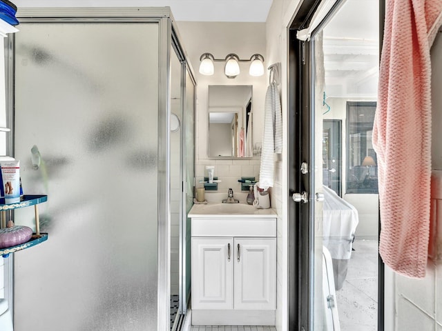 bathroom with backsplash, walk in shower, vanity, and tile floors