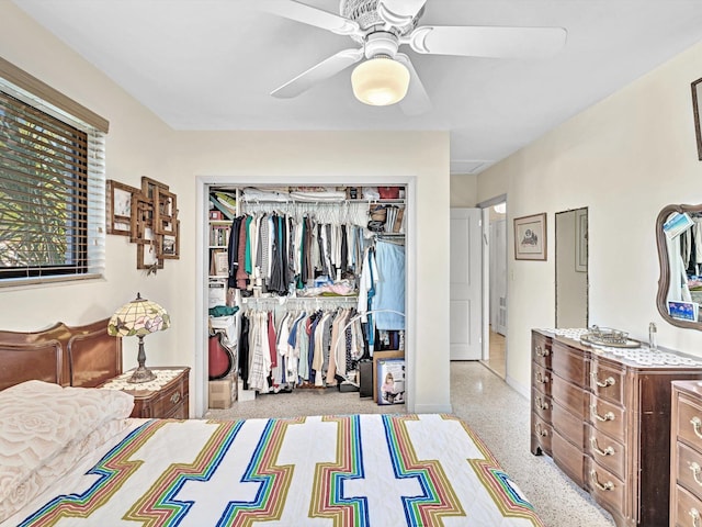 carpeted bedroom featuring ceiling fan and a closet