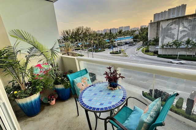 view of balcony at dusk