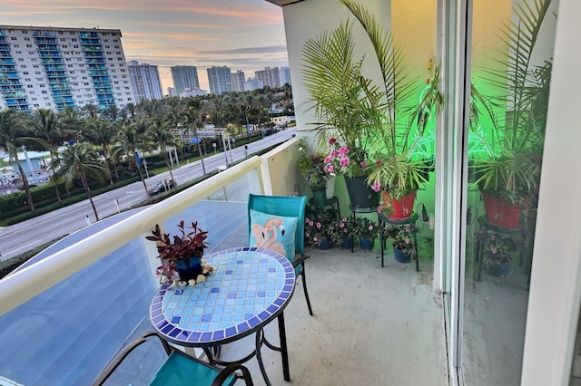 view of balcony at dusk