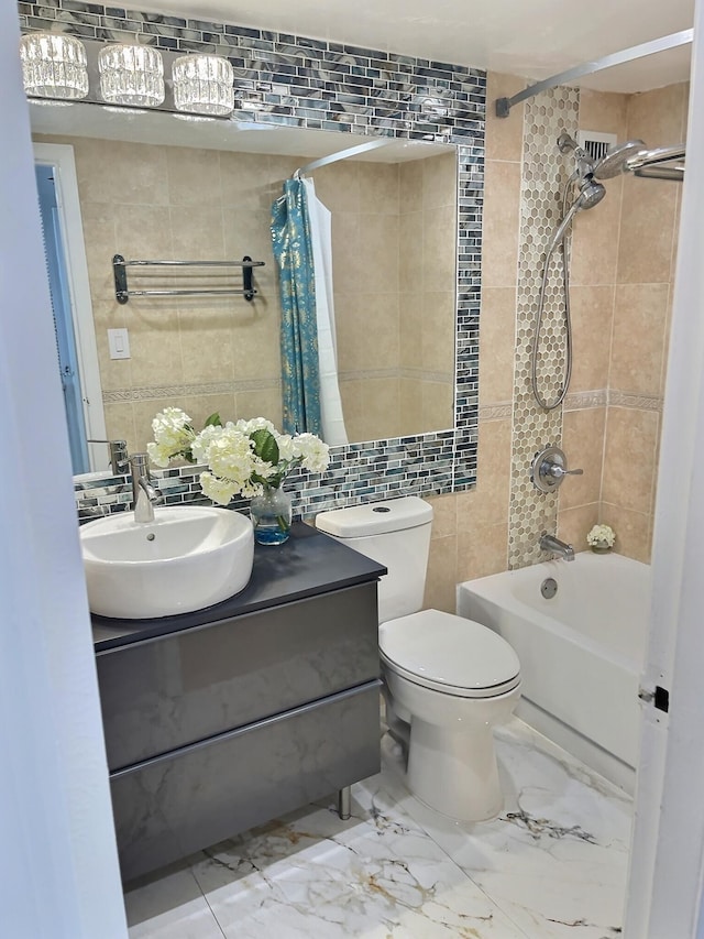 full bathroom featuring vanity, tile patterned floors, tile walls, shower / bath combination with curtain, and toilet