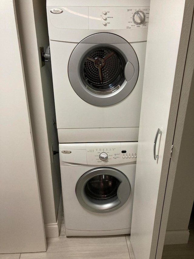 washroom with stacked washer / dryer