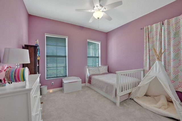 bedroom featuring ceiling fan and light colored carpet