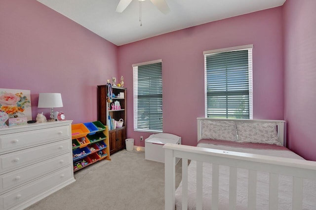 carpeted bedroom with ceiling fan