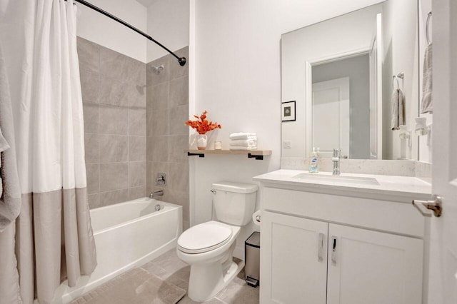 full bathroom with tile floors, shower / bath combo, vanity, and toilet