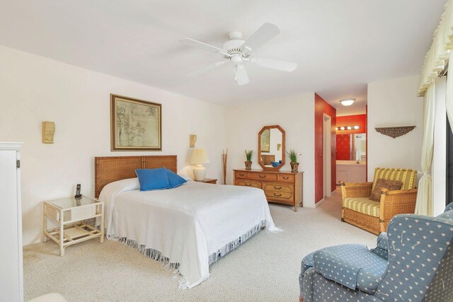 bedroom featuring ceiling fan, connected bathroom, and carpet flooring