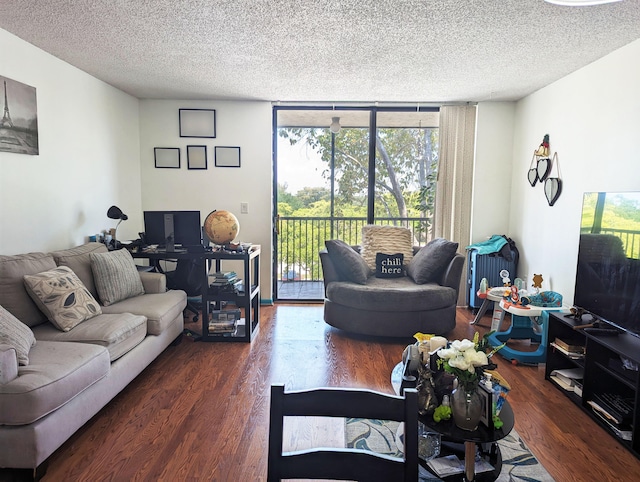 living room featuring dark hardwood / wood-style flooring, floor to ceiling windows, and a textured ceiling