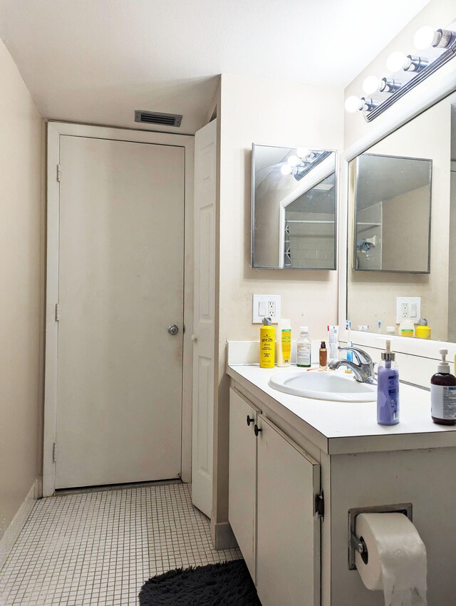 bathroom featuring tile patterned floors and vanity