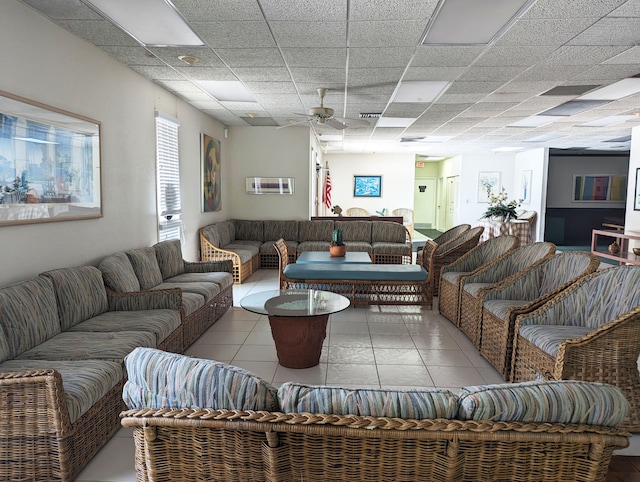 tiled living room featuring a paneled ceiling and ceiling fan