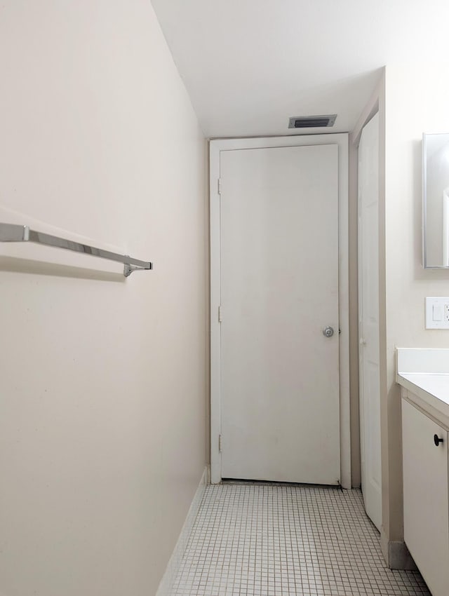 bathroom featuring tile patterned floors and vanity