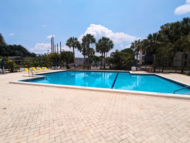 view of swimming pool featuring a patio