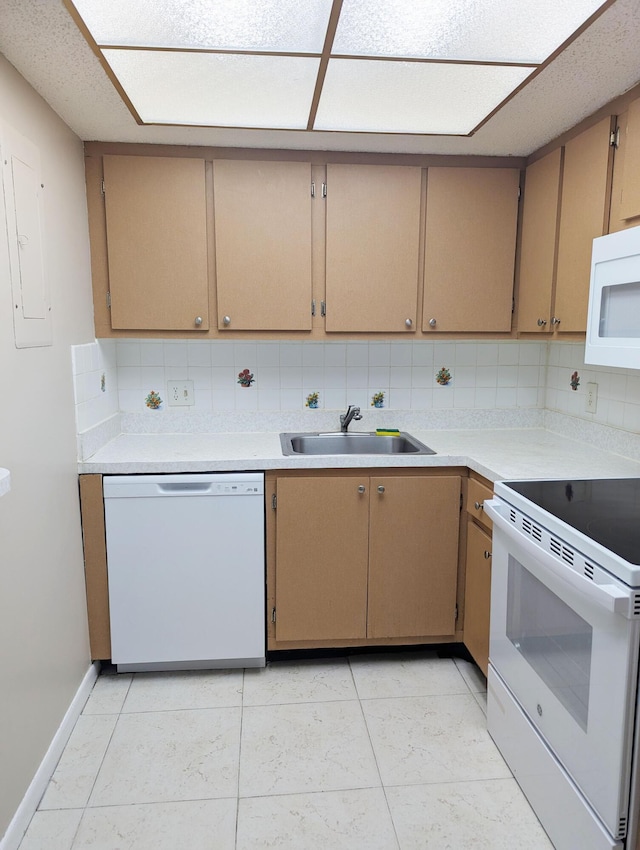 kitchen featuring light tile patterned flooring, white appliances, sink, and backsplash