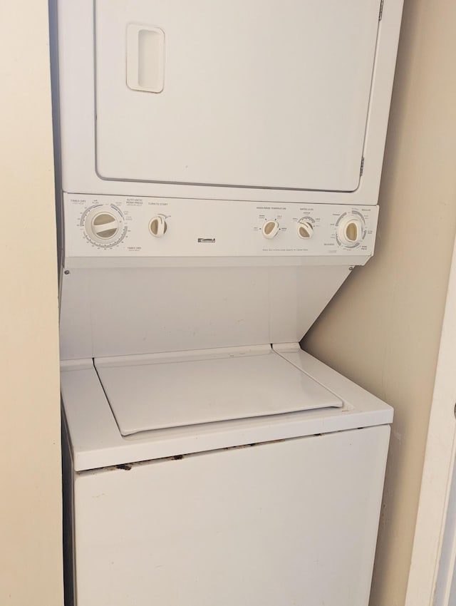 laundry area with stacked washer / drying machine